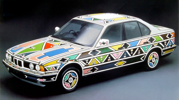 Esther Mahlangu painted her BMW in over a week in 1991, using feathers to apply the paint, as part of the Art Car series which started in the 1970s.
In the late-1980s BMW had made a strong stand internationally for SA art at a time of change by getting the engaging Ndebele artist Esther Mahlangu to paint their desirable car and turn it into an artwork which vibrantly reflected her cultural heritage.