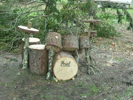 A full drum kit made of real pieces of tree trunk
