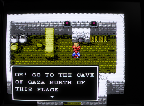 Screenshot from the NES video game Gargoyle's Quest II where player character Firebrand has encountered a non-playable character stating:
