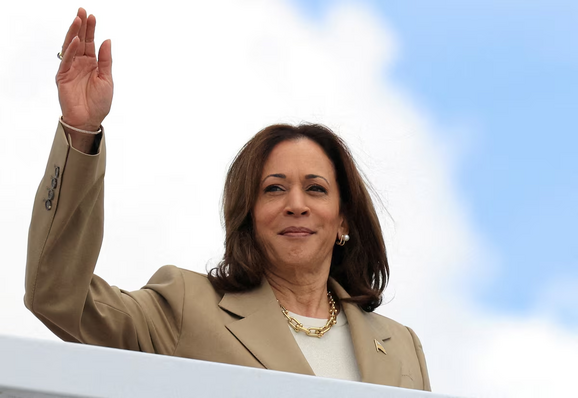 U.S. Vice President Kamala Harris waves as she boards Air Force Two to depart on campaign travel to Philadelphia, Pennsylvania, at Joint Base Andrews, Maryland, U.S., July 13, 2024. REUTERS/Kevin Mohatt /File Photo