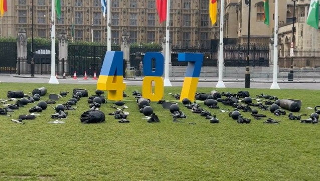 In London, at Parliament Square., a large number 487, painted in the colors of the Ukrainian flag, represents the approximate number of athletes who have perished since the invasion began. 

Sports equipment used by the deceased athletes is displayed around the numbers, symbolizing their lost potential and the tragedy of their deaths.