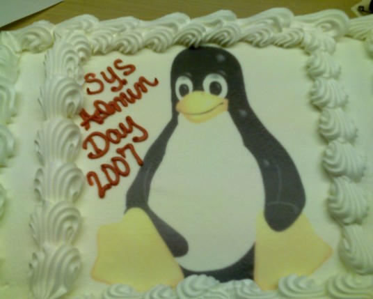 A cake with a Linux penguin and the text 