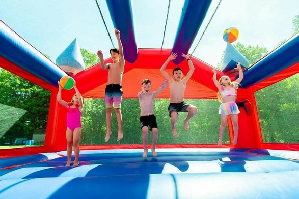 Description Provided in Tweet: 
Kids jumping and playing in bounce house
---------------
Azure Generated Tags:
playground (96.65% confidence)
inflatable (91.45% confidence)
outdoor (90.27% confidence)
girl (88.55% confidence)
clothing (87.99% confidence)
bounce house (87.08% confidence)
outdoor play equipment (86.59% confidence)
person (84.37% confidence)
summer (54.18% confidence)
