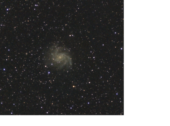 A star field with a spiral galaxy at the center, facing the viewer face-on