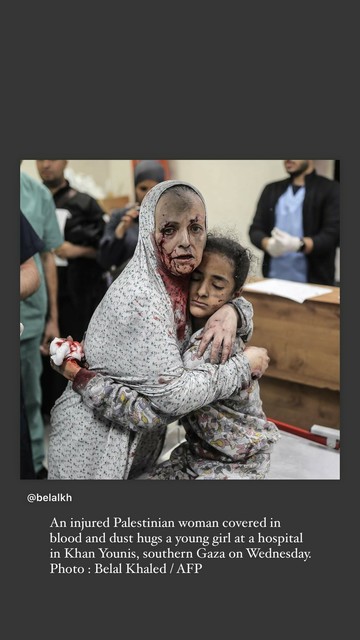 An injured Palestinian woman covered in blood and dust hugs a young girl at a hospital in Khan Yunis, in Southern Gaza on Wednesday 

photo Belal Khaled / AFP