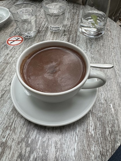 A cup of hot chocolate on a cafe’s terrace table in Berlin