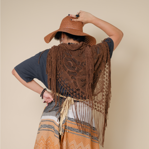 Me in my Boho outfit. My back is turned towards you. I am draped with a netted scarf. I am wearing a makeshift skirt made out of patterned pashmina scarf held together by a woven yarn belt.