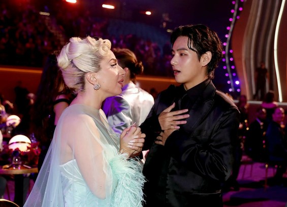Lady Gaga and V from BTS at the 2022 Grammy Awards.