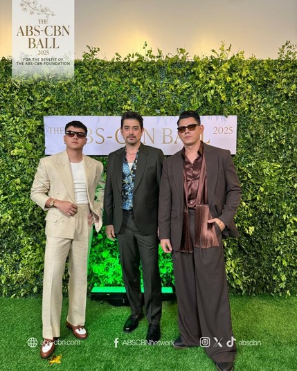 Daniel Padilla in a cream suit and pants look. Ian Veneracion wearing a button-up shirt with tropical print underneath a dark grey suit and pants. Richard Gutierrez in an all-brown look.