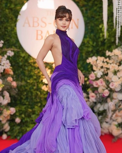 Maris Racal in a flowy dress of purple hues, with her sides and back exposed.