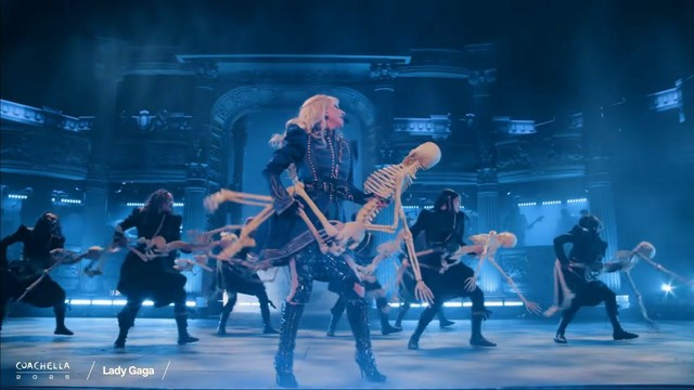 Lady Gaga cradling a skeleton while performing Zombieboy at Coachella.