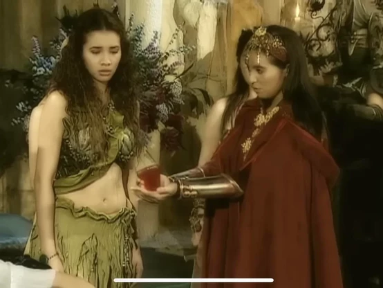 Shot from Encantadia (2005) with Karylle as Alena and Sunshine Dizon as Pirena physically holding the gem of fire, which seems to be a red resin prop.