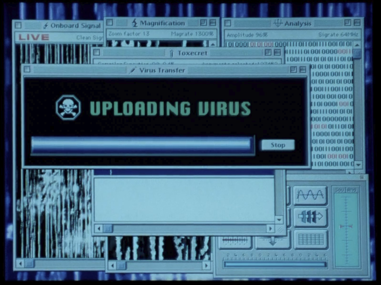 Screenshot from the movie Independence Day (1996) showing a computer screen containing a window that reads "Uploading Virus&quot; with a skull and crossbones logo and a nearly complete progress bar.