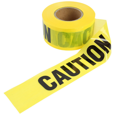 A roll of bright yellow caution tape partially unrolled, displaying bold black “CAUTION” text across the tape.

