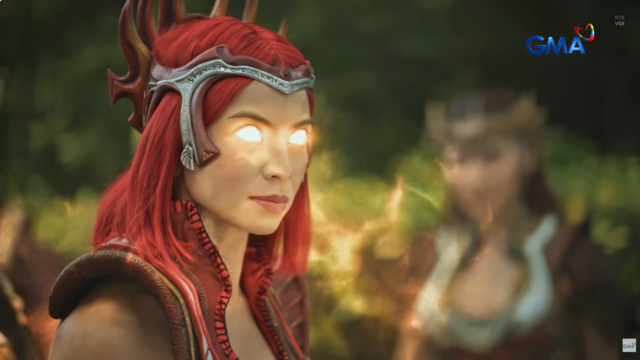 Pirena with her newly enhanced godly powers activating without the use of any elemental gems. Her eyes glow gold, while golden aura surrounds her.