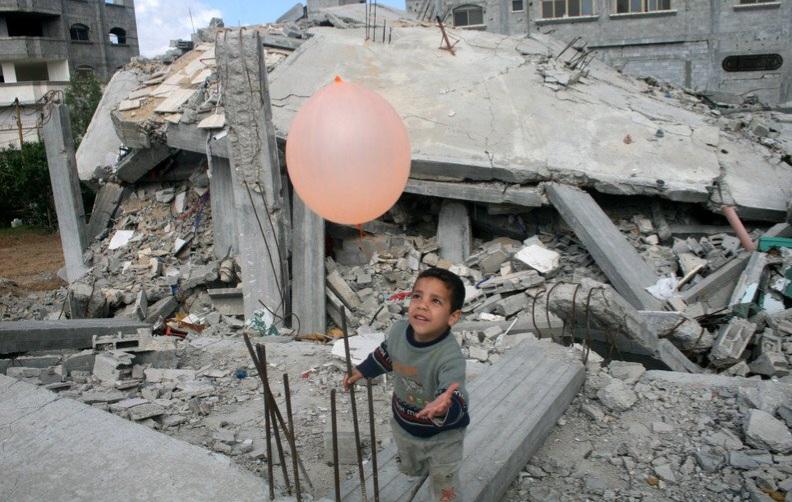 Pic provided by @TyseerIbrahim a few years back.

It shows a young child in gaza playing in the  ruins of buildings chasing a pink air balloon