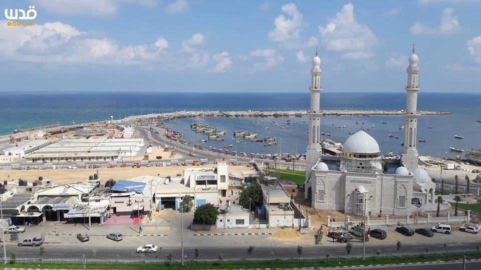 View of the white mosque from the back,  we see the Gaza marina along with a wide view of the Mediterranean. Some commercial buildings on the left.

Pic provided by Quds News Network